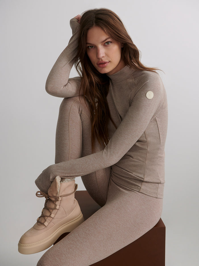 Taupe Marl|Front view of the Varley Always Warm Baselayer Top in Taupe Marl, a thermal base layer with long sleeves and soft knit fabric.
