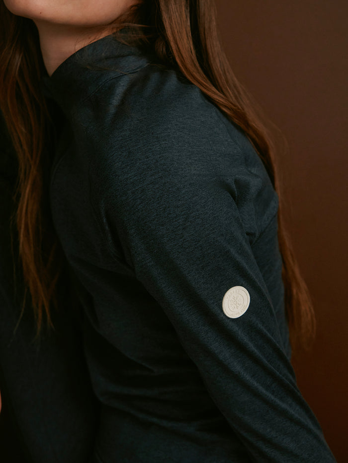 Black Marl|Varley Always Warm Half Zip Baselayer in Black Marl, front view showing a half-zip closure and long-sleeve baselayer fabric.