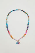 The Artisanal Rainbow Agate Toggle Necklace features multicolored agate beads in assorted shapes and sizes, accented with a cluster of vibrant charms at the center—handmade with care in Scotland.