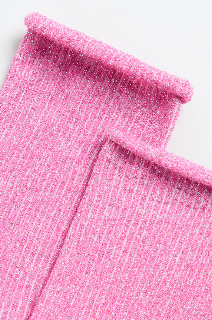 Close-up of two Bamboo Sparkle Fuchsia Socks with pink, ribbed, glittery fabric and rolled edges, laid side by side on a white background.
