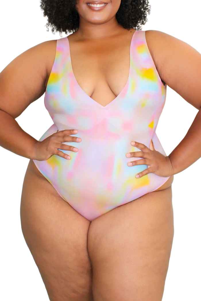 Front view of Bellows Plunge High-Cut one-piece showcasing deep V-neck, high-cut leg, and pastel watercolor print on white background | nesharae__ / 2XL