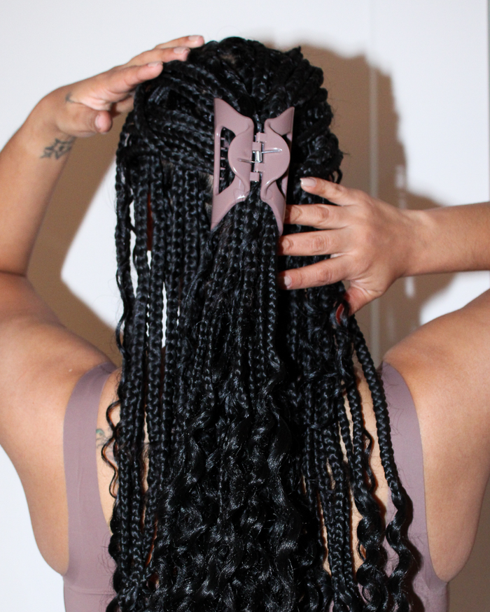 Back view of Cozy Clip x onewith Flexible Claw Clip showcasing its Cove color secured in long braided hair