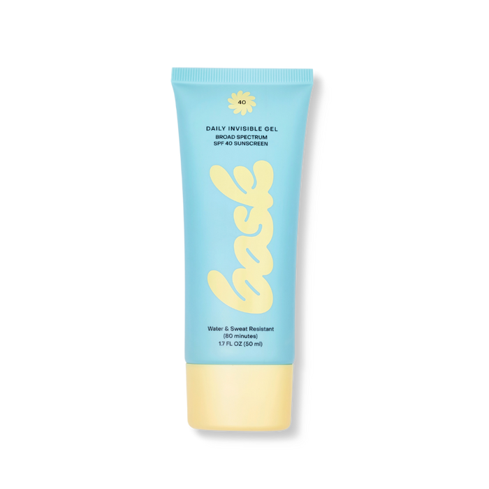 Light-blue sunscreen tube with yellow cap labeled 'bask' in cursive script