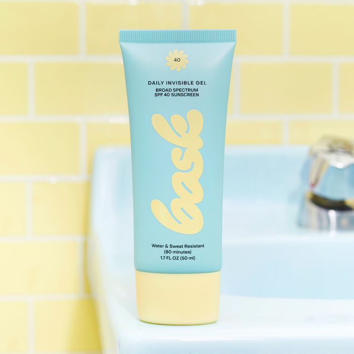 Front view of Daily Invisible Gel SPF 40 Sunscreen showing 80-minute water and sweat resistance against yellow tiles