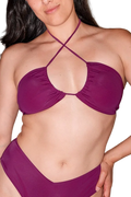 Front view of the purple Foxon Multi-Way Bandeau Bikini Top on a model, showcasing crossed halter straps and gathered cups