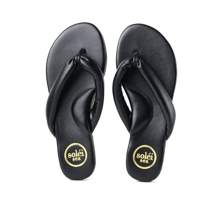 Black rubber flip-flops with toe-post straps and circular heel logos