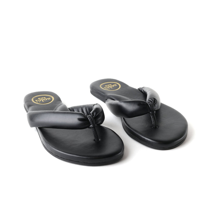 Front three-quarter view of Gisel Noir sandals showcasing padded straps and cushioned footbeds with a white background