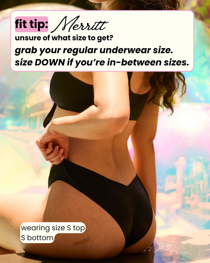 Black Merritt Dipped Cheeky Bikini Bottom on model with fit tip: regular underwear size, size down between sizes