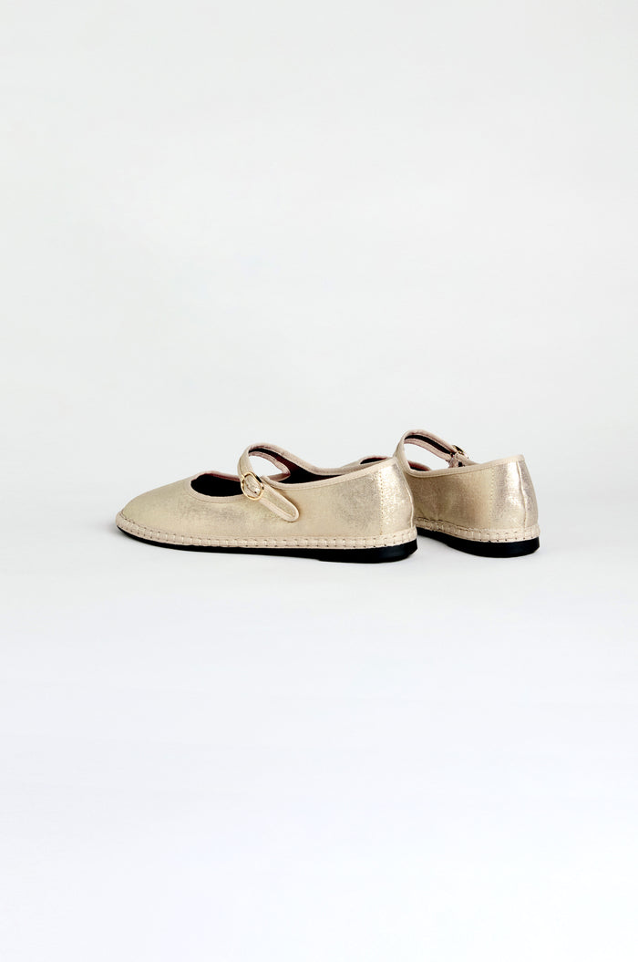 Metallic Mary Jane Shoes, handmade in Spain with recycled bicycle tyre soles and a small buckle strap, displayed on a plain white background.