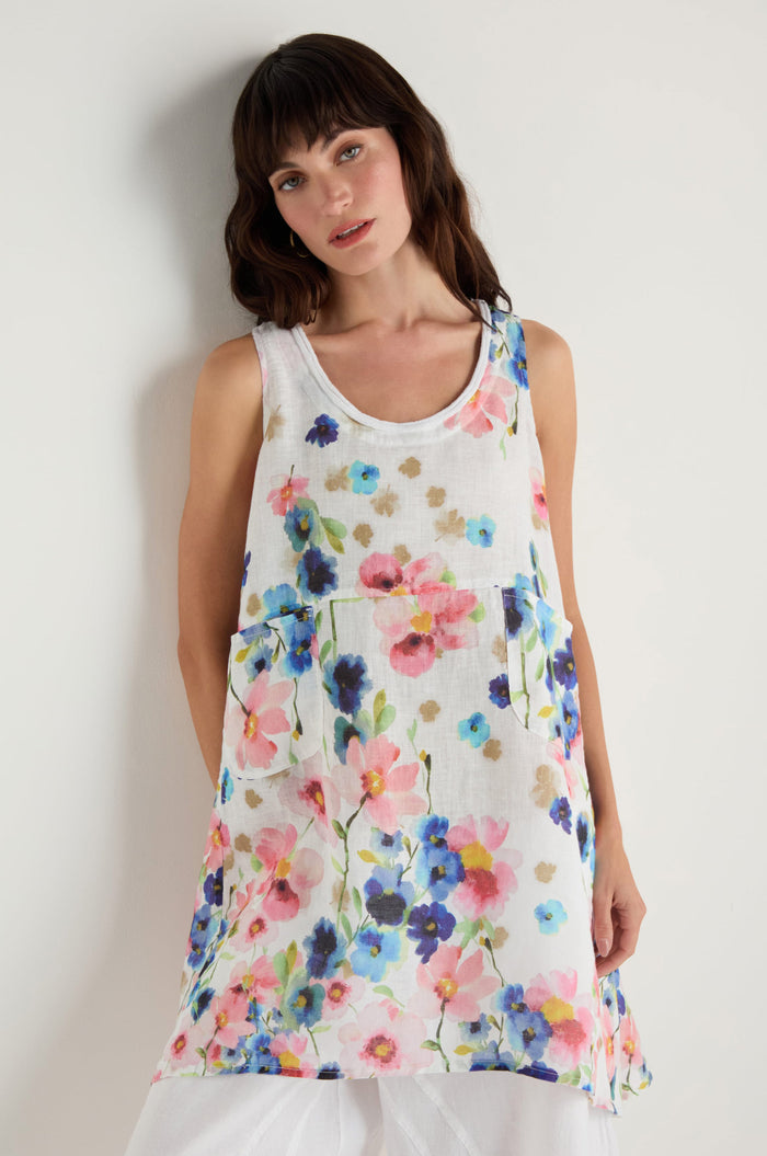 A woman models the Primrose Print Sleeveless Linen Tunic against a plain white background.