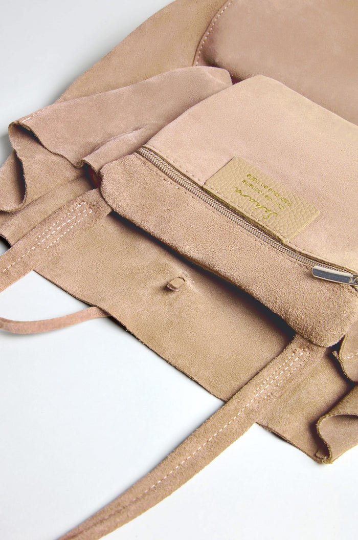 Close-up of the Soft Suede Sand Tote Bag's open, spacious interior pocket featuring a zipper and fabric label, emphasizing its minimalist design.