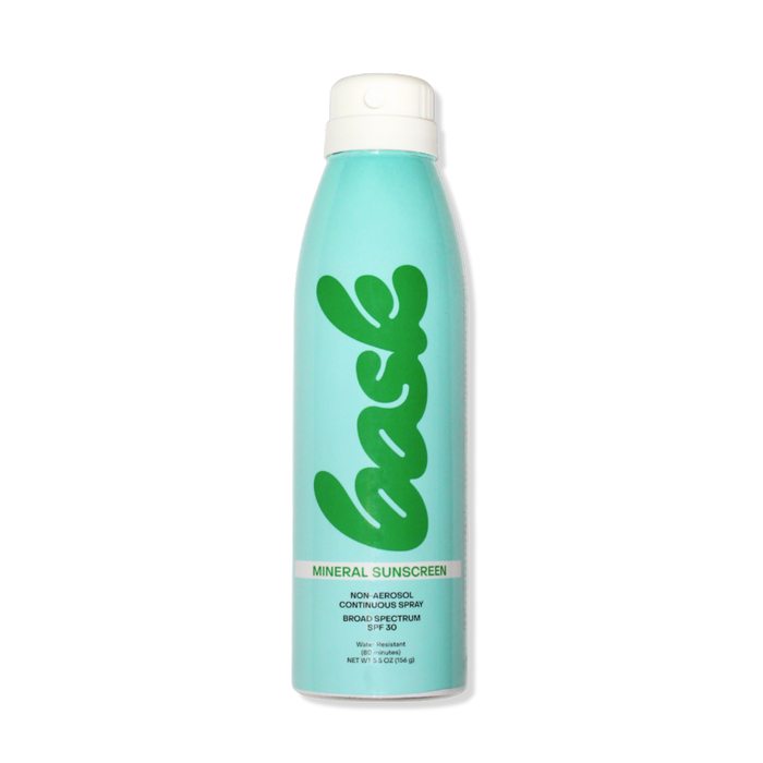 Front view of Bask SPF 30 mineral non-aerosol spray can showcasing continuous spray labeling on a black background