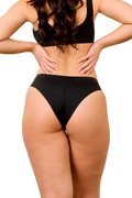 Front view of Woodmont Cheeky Bikini Bottom showcasing black raw-cut edges and cheeky fit on a model